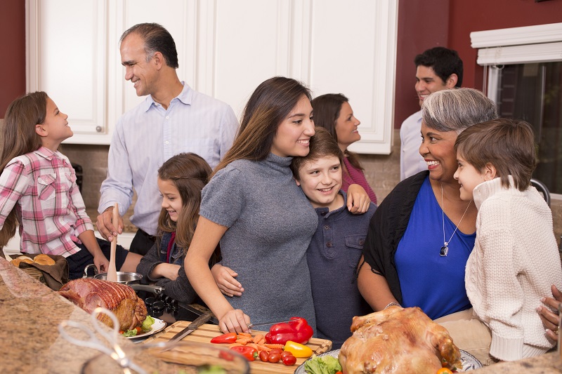 Family gathered in kitchen for holiday meal