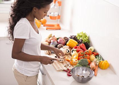 women cutting vegetables